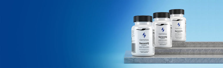 Three bottles of SevenIQ supplements on a gray platform with a blue background